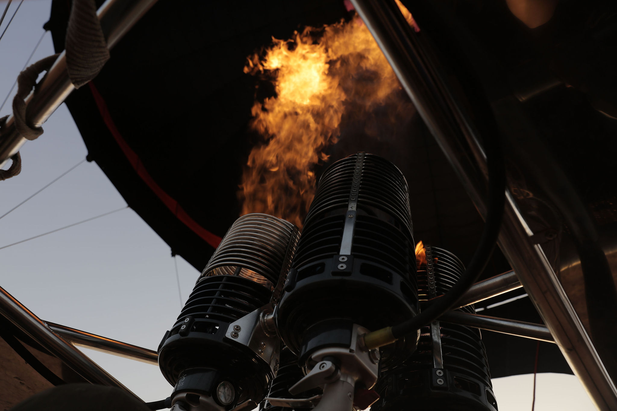 Looking up at the burner firing into the envelope from inside a balloon basket