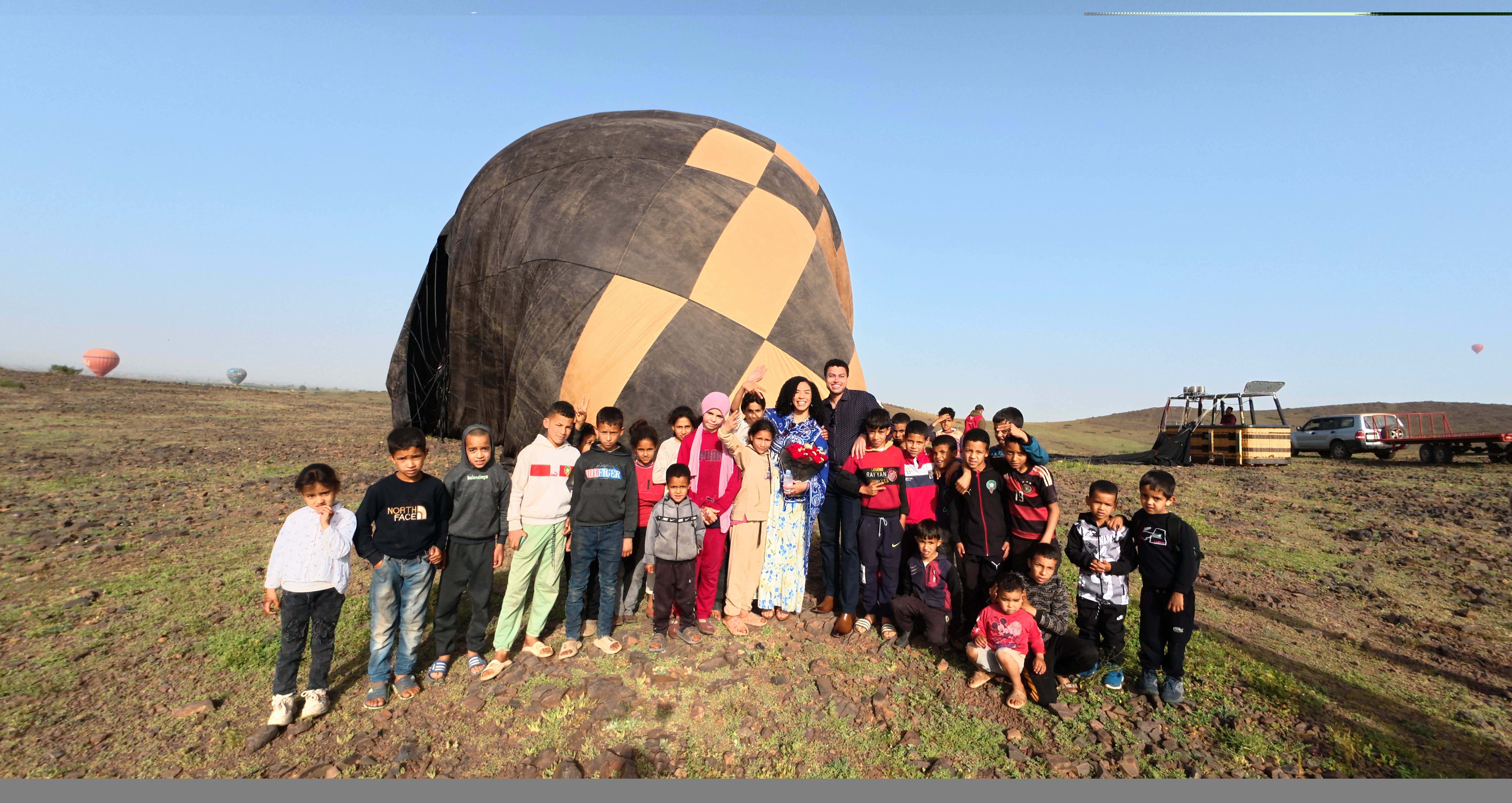 Wide view of balloon envelopes on the launch field