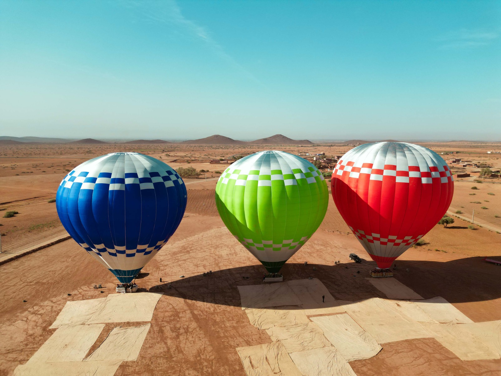 Three balloons standing in daylight before a flight, Marrakech