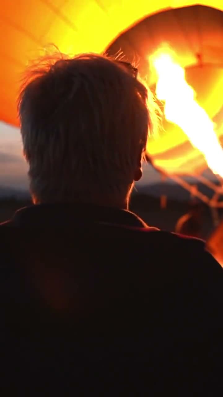 The burner firing into a pink checkered envelope on the launch field