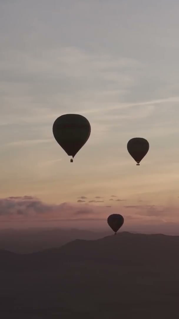 Aerial overflight of a village near the launch field, then inflation from above