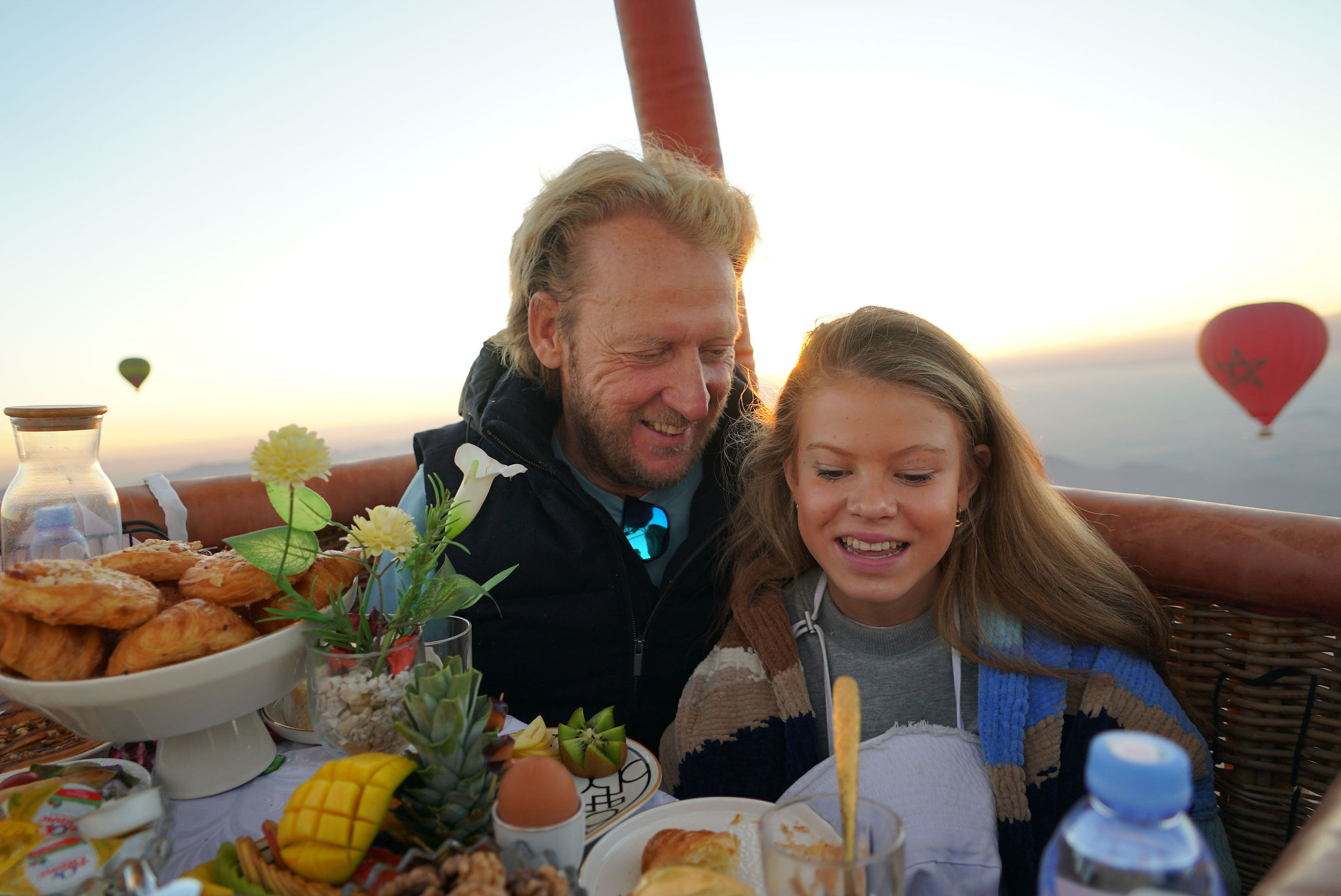 Breakfast served in a small balloon basket over the Marrakech plain at sunrise