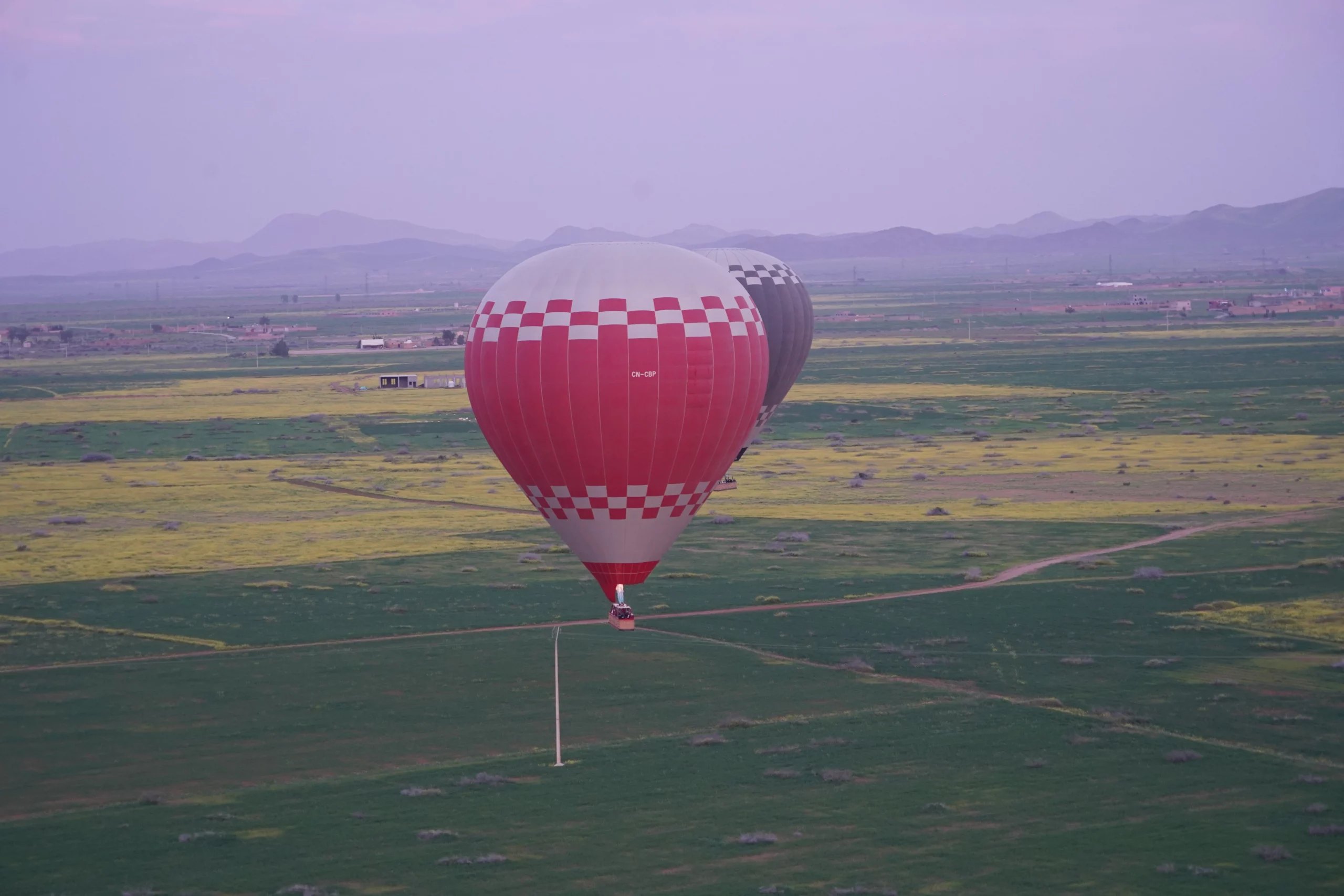 Hot air balloon over countryside near Marrakech